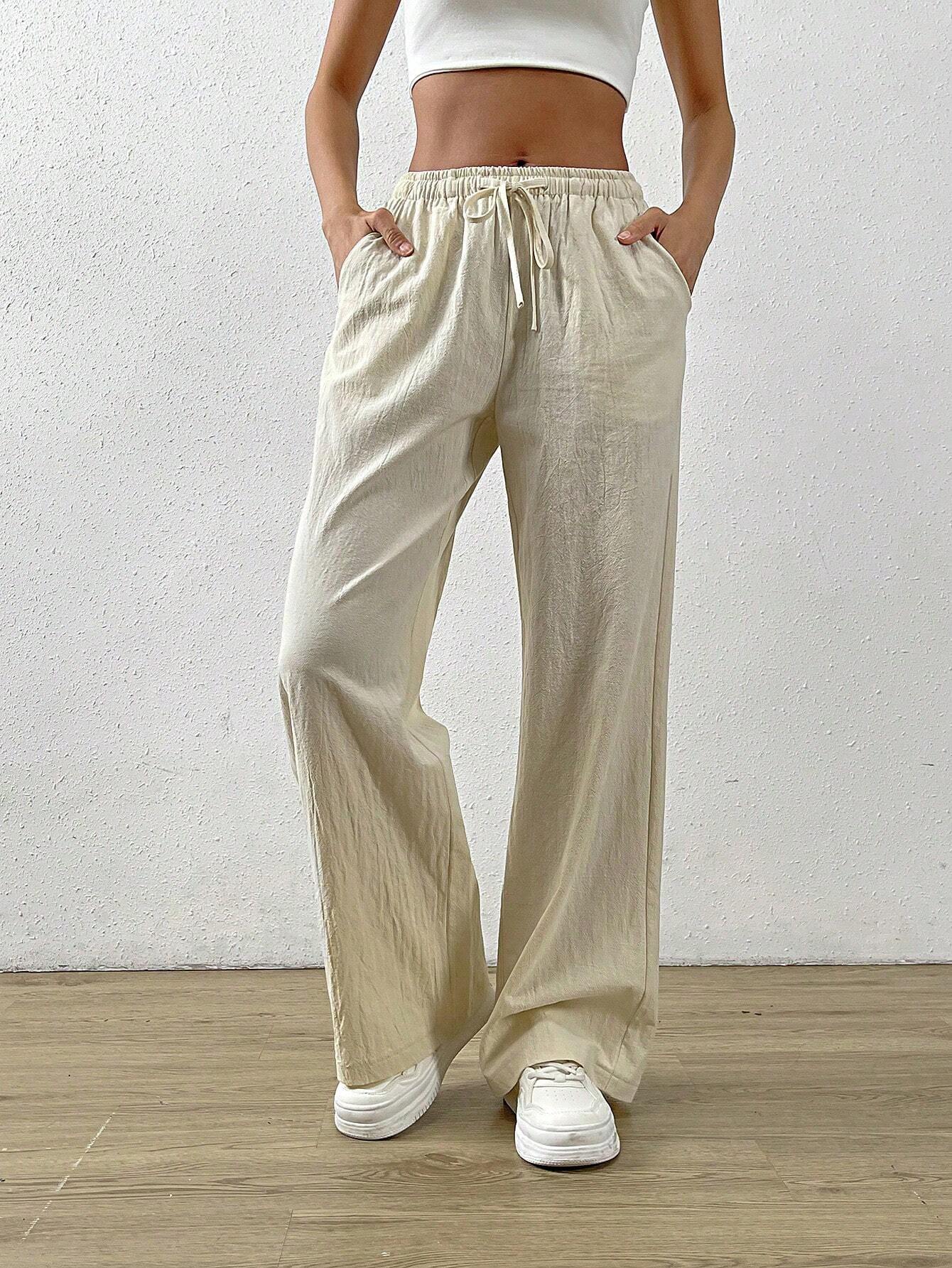 Pamučne labave ravne hlače s kosim džepom na struku