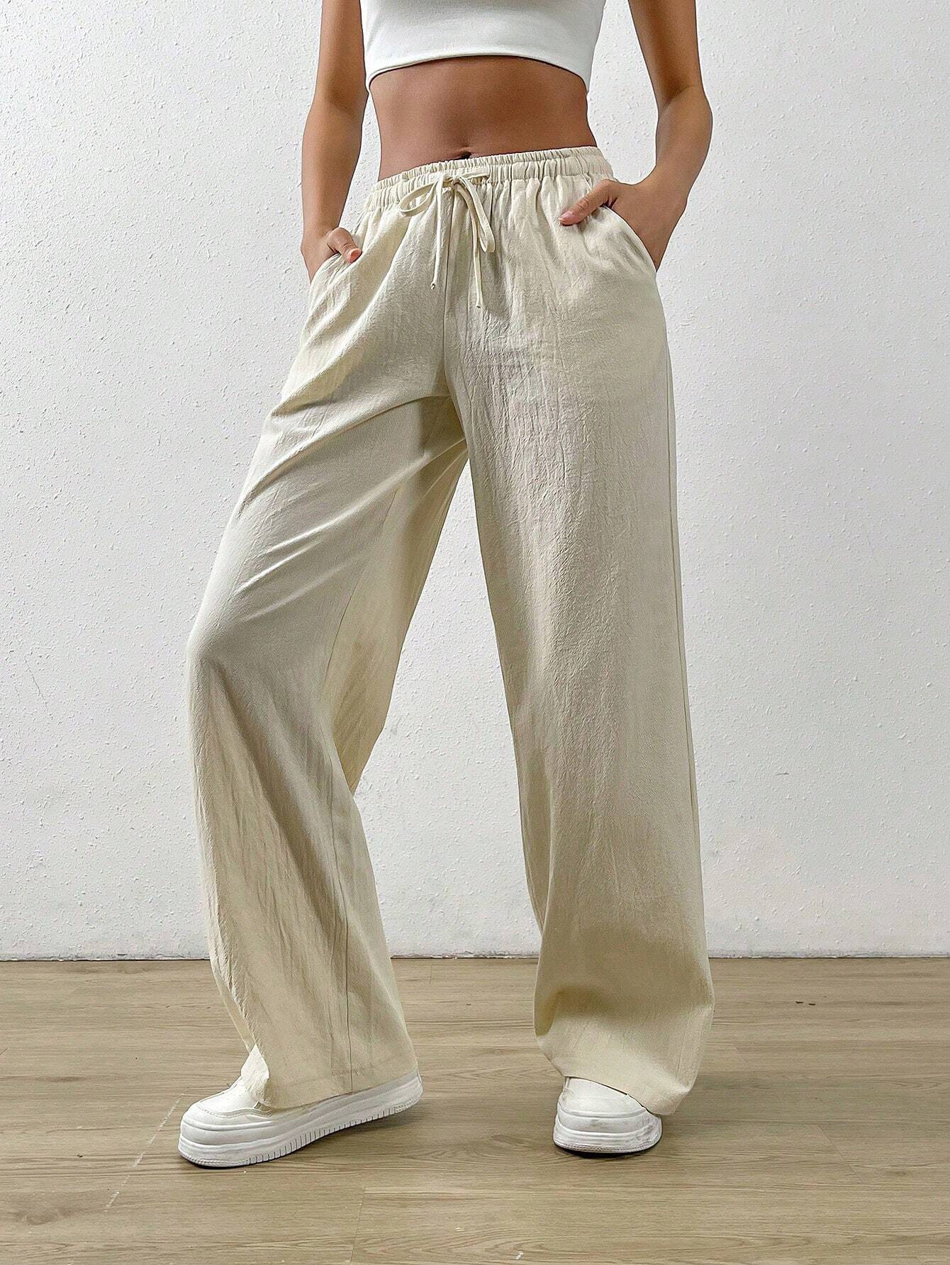 Pamučne labave ravne hlače s kosim džepom na struku